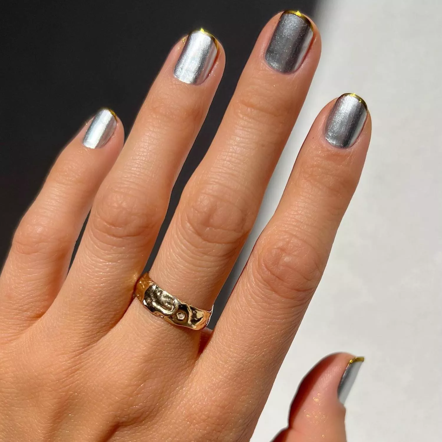 Silver chrome nails with gold baby French tips
