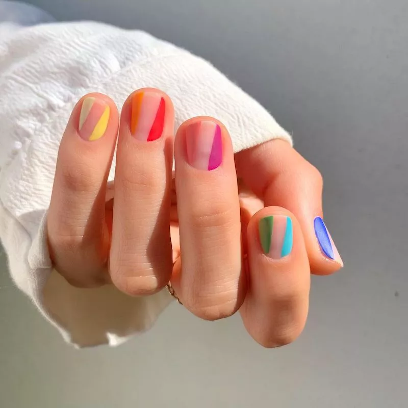 Negative space rainbow summer nail design