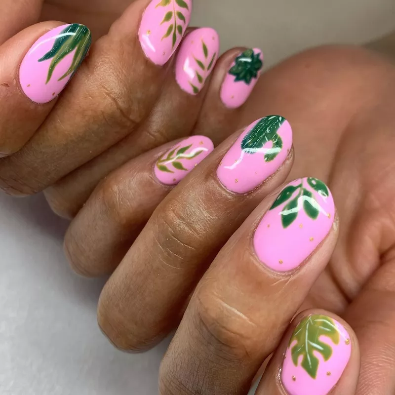 Neon pink nails with plant designs